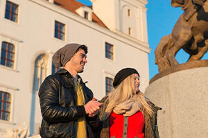 Two Topdeck travelers visiting Bratislava Castle, a famous hilltop castle.