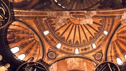 A view of one of the grand domed ceilings of the Hagia Sophia, one of the world's most iconic religious sites located in Istanbul.